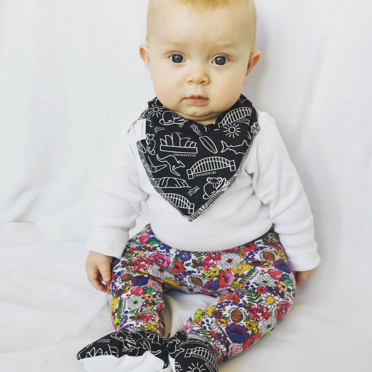 Chuckles and Caz Australian icon baby bib on baby.